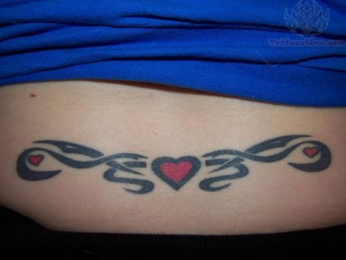 Tiny Heart And Tribal Lower Back Tattoo For Women